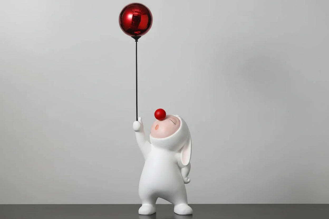 Close-up of large lovable figurine with balloon