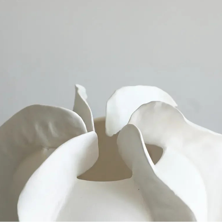 Close-up of ceramic carambola vase textured finish