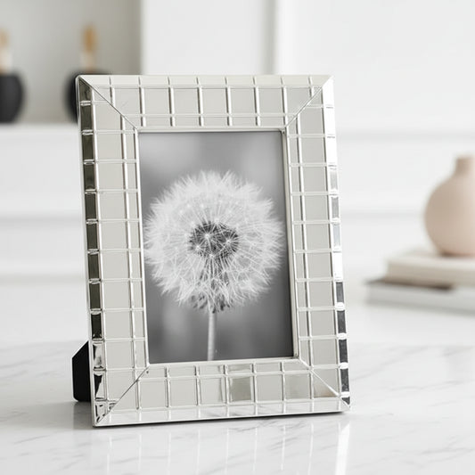 Minimalist metal photo frame shelf styling