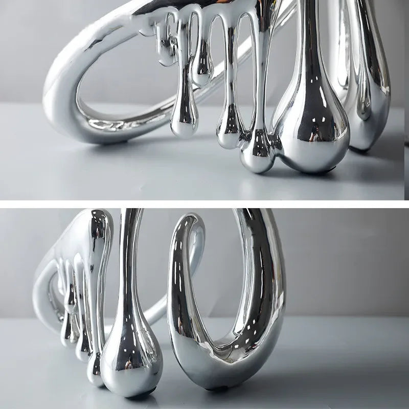 Contemporary abstract sculpture home decor silver finish close-up