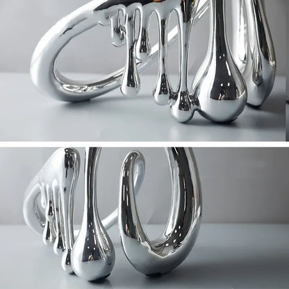 Contemporary abstract sculpture home decor silver finish close-up