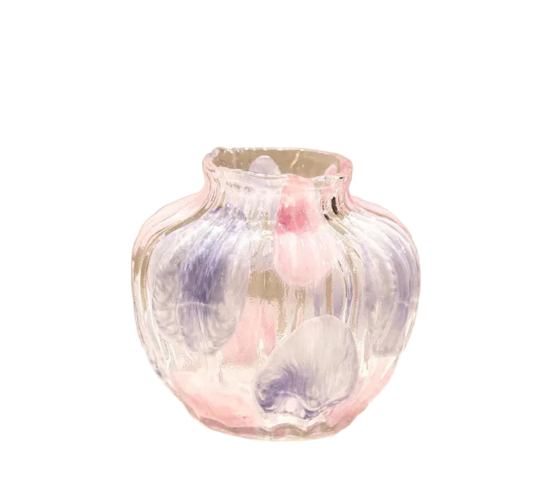 Decorative glass vase with pastel colors on a beige background