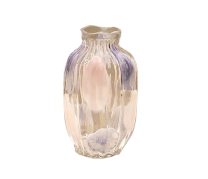 Decorative glass vase with floral design on a beige background