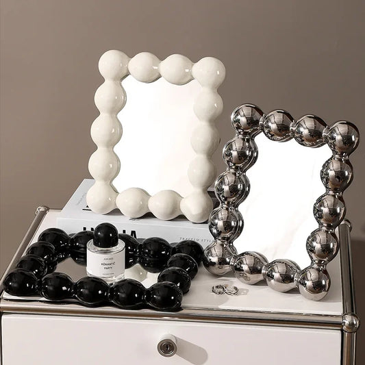 Round bubble mirrors with a ceramic frame decor