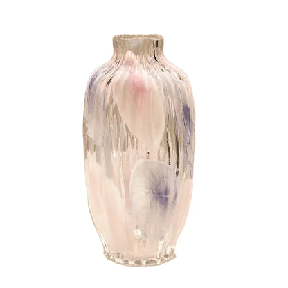 Decorative glass vase with abstract design on a beige background